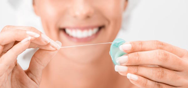 Floss Your Way Towards Having Whiter Teeth