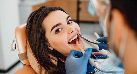 young female patient visiting dentist office
